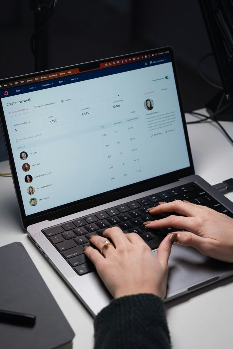 Email inbox open on a laptop while someone types